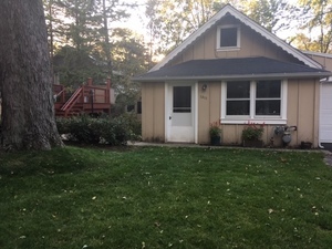1211 Hunter Road Wilmette, IL 60091 - Photo 1 of 1 a front view of a house with garden