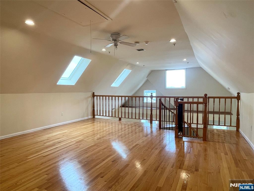 662 Undercliff Avenue, Unit 2 Edgewater, NJ 07020 - Photo 7 of 17 wooden floor in an empty room with a window