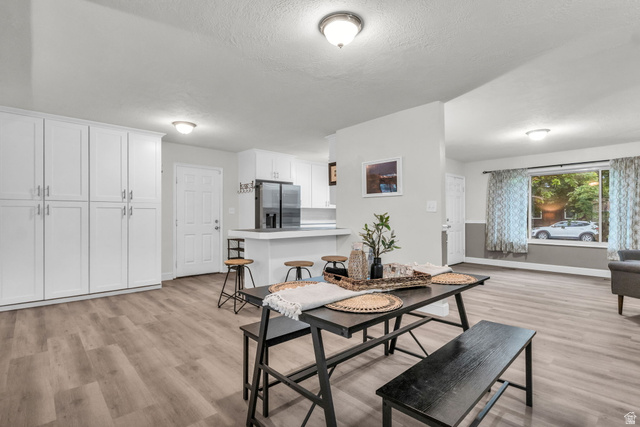 1539 East 450 South Springville, UT 84663 - Photo 9 of 49 Open concept living area featuring wood-finish flooring, recessed lighting, and a neutral color palette
