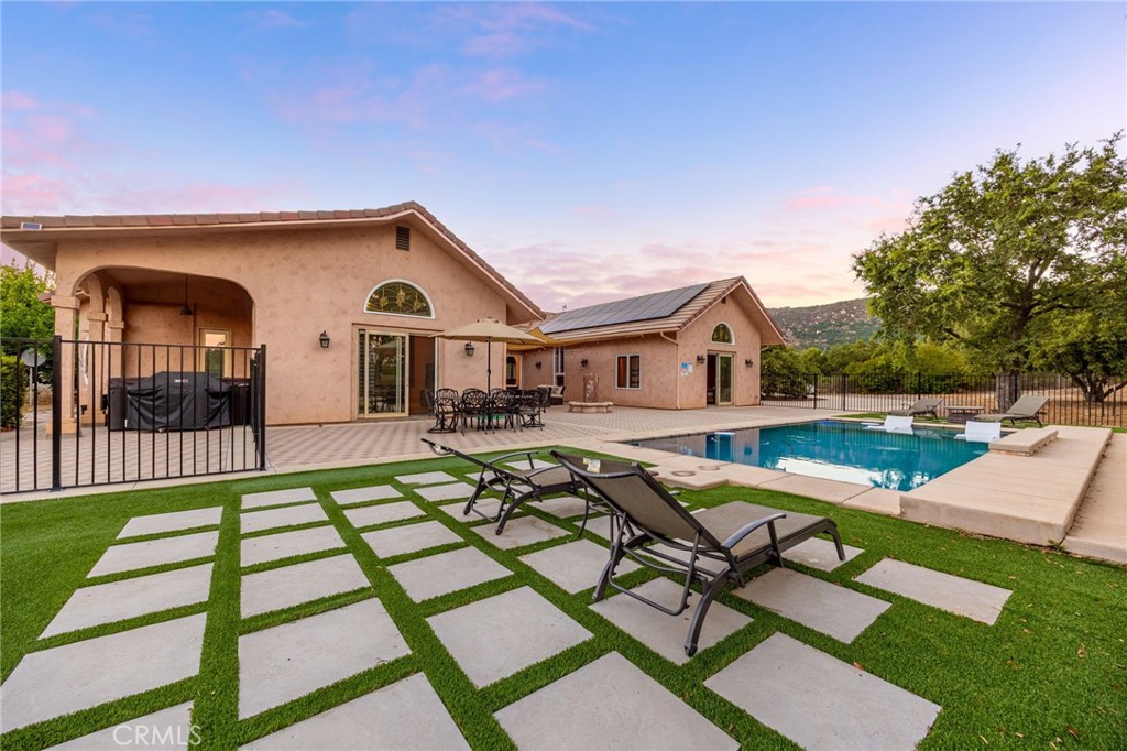 44350 Tortuga Road Temecula, CA 92590 - Photo 1 of 1 a view of a house with pool and chairs