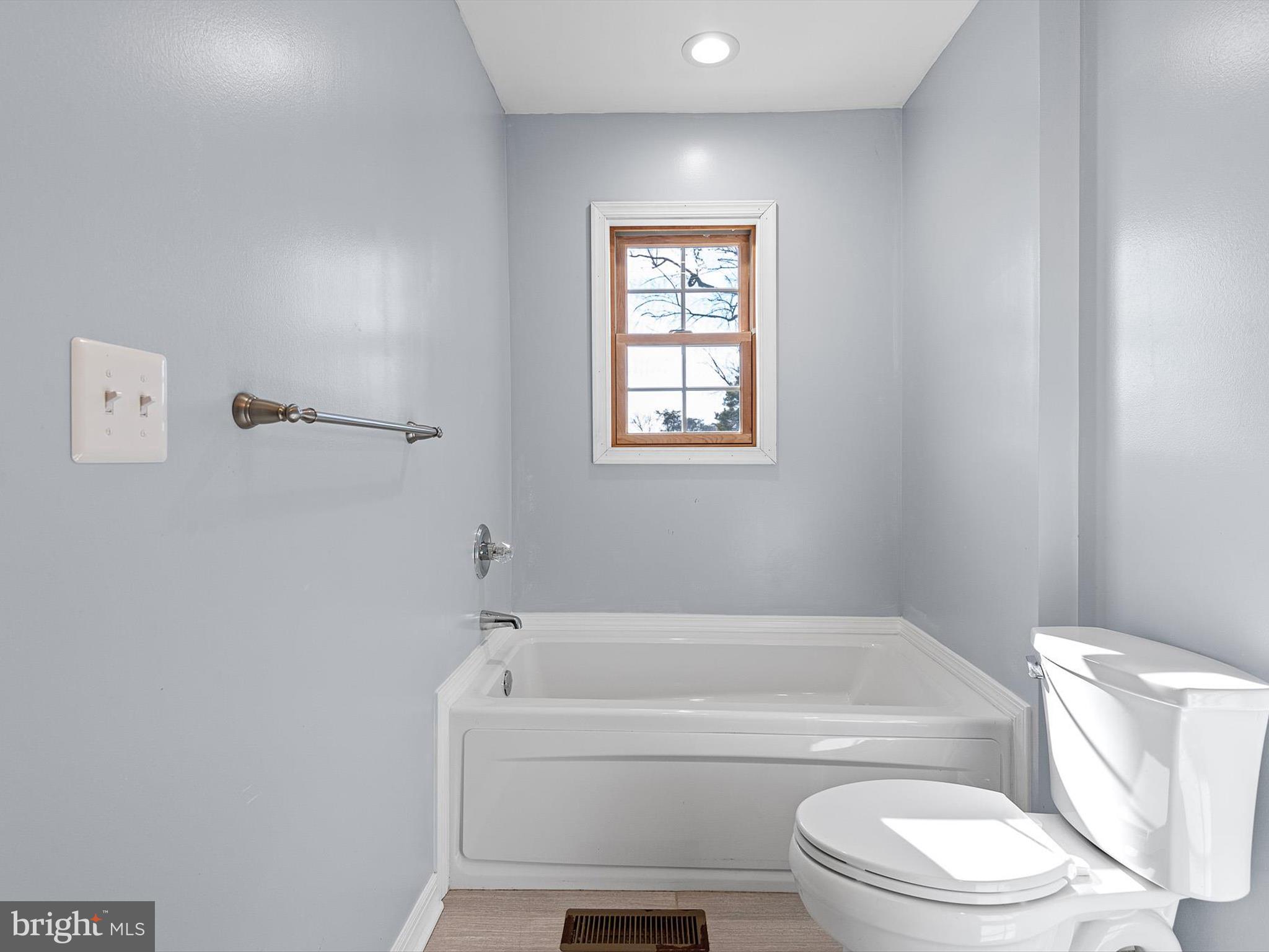 176 Old Mill Road Conowingo, MD 21918 - Photo 13 of 20 a bathroom with a toilet and a bathtub