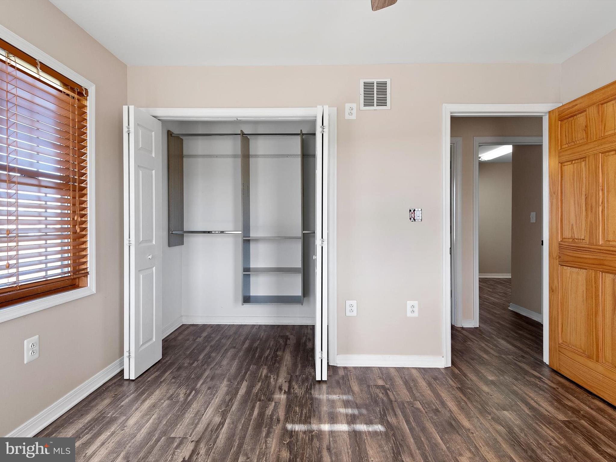 176 Old Mill Road Conowingo, MD 21918 - Photo 18 of 20 an empty room with wooden floor and windows