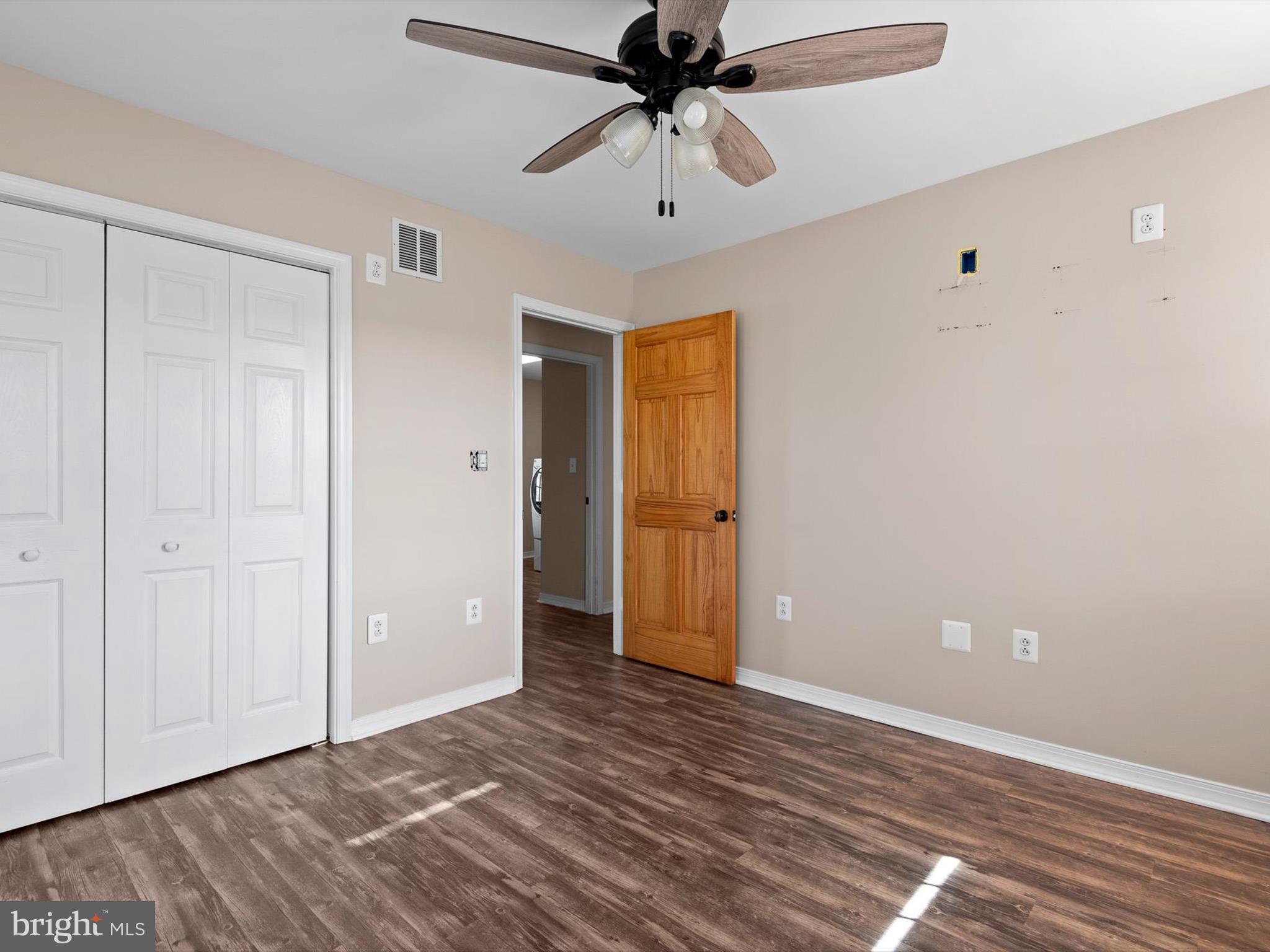 176 Old Mill Road Conowingo, MD 21918 - Photo 19 of 20 a view of a room with wooden floor and a ceiling fan