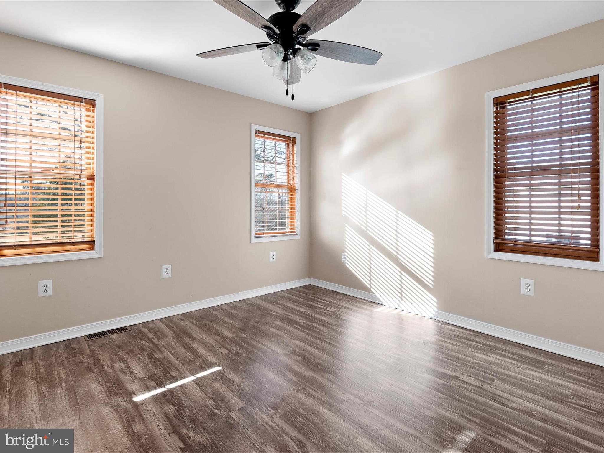 176 Old Mill Road Conowingo, MD 21918 - Photo 20 of 20 a view of an empty room with wooden floor and a window