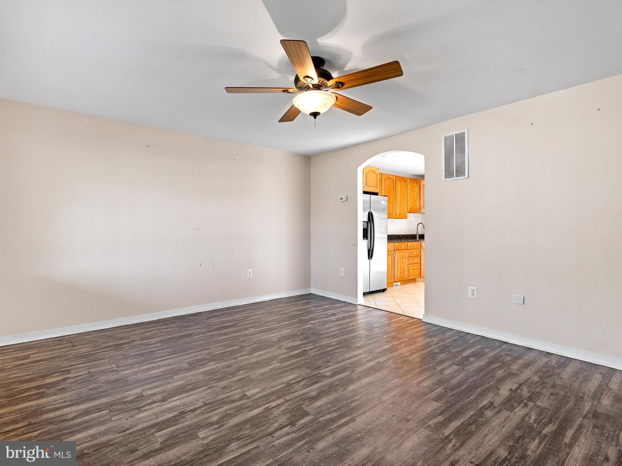 176 Old Mill Road Conowingo, MD 21918 - Photo 7 of 20 a view of an empty room with window and wooden floor