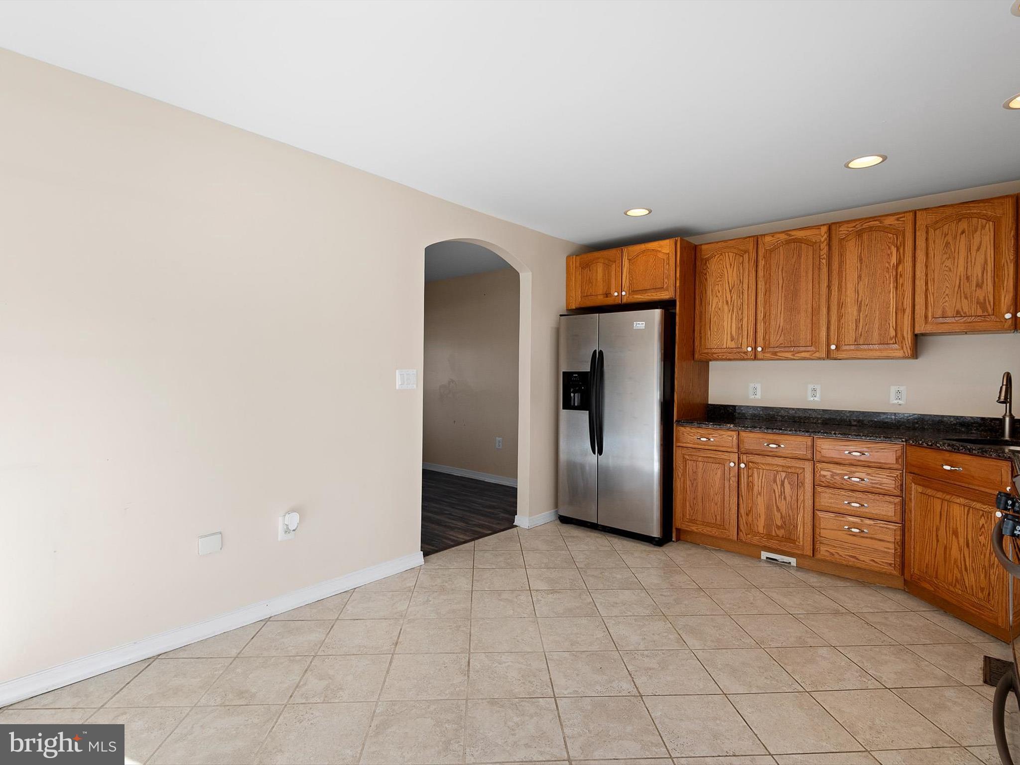 176 Old Mill Road Conowingo, MD 21918 - Photo 9 of 20 a kitchen with stainless steel appliances granite countertop a refrigerator and a sink