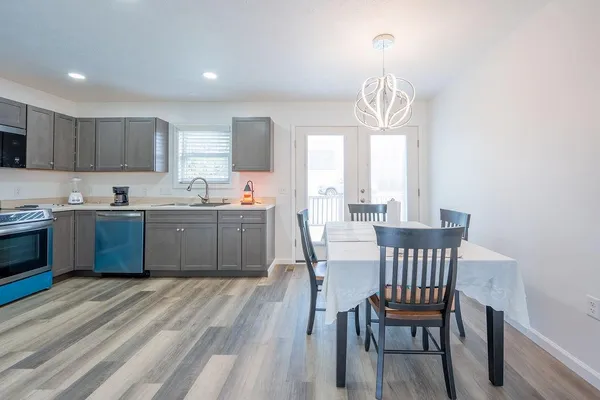 a view of a dining room with furniture window and wooden floor