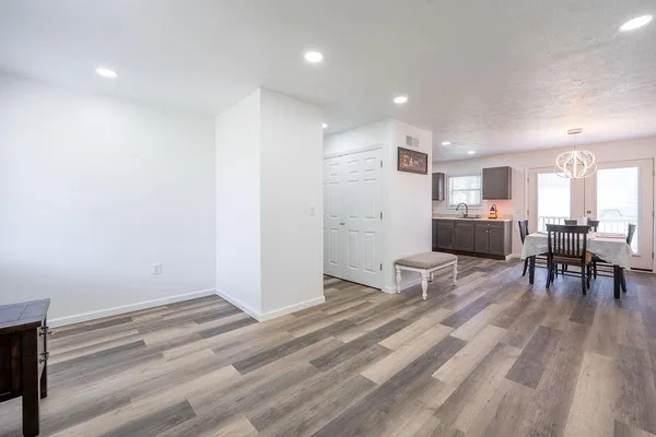 a view of work space with wooden floor and furniture