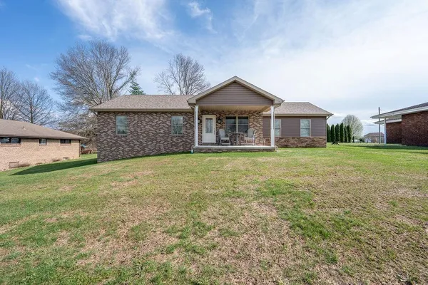 front view of a house with a yard