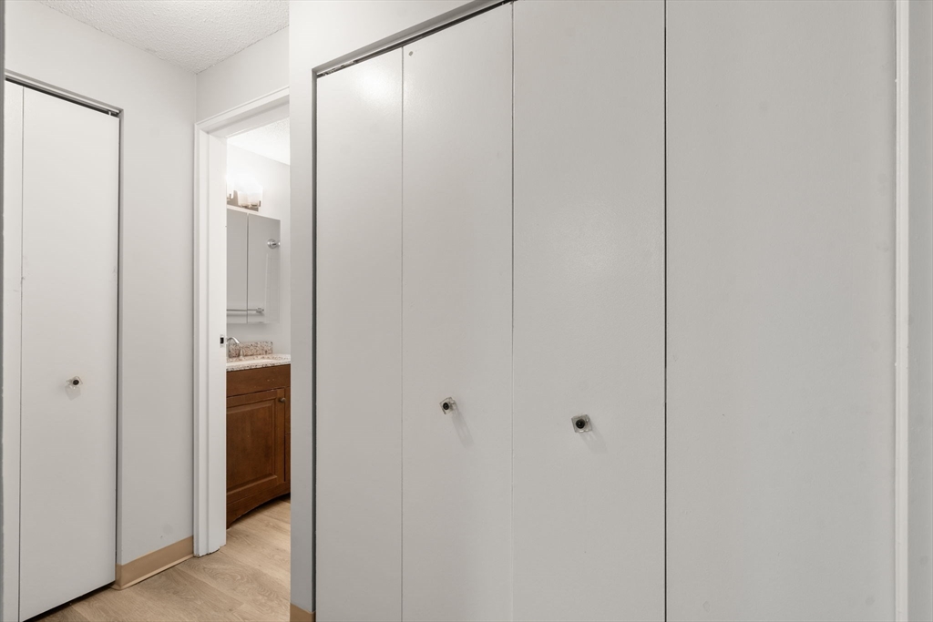 11 Silver Hill Lane, Unit 11 Natick, MA 01760 - Photo 14 of 22 a view of a bathroom from a hallway