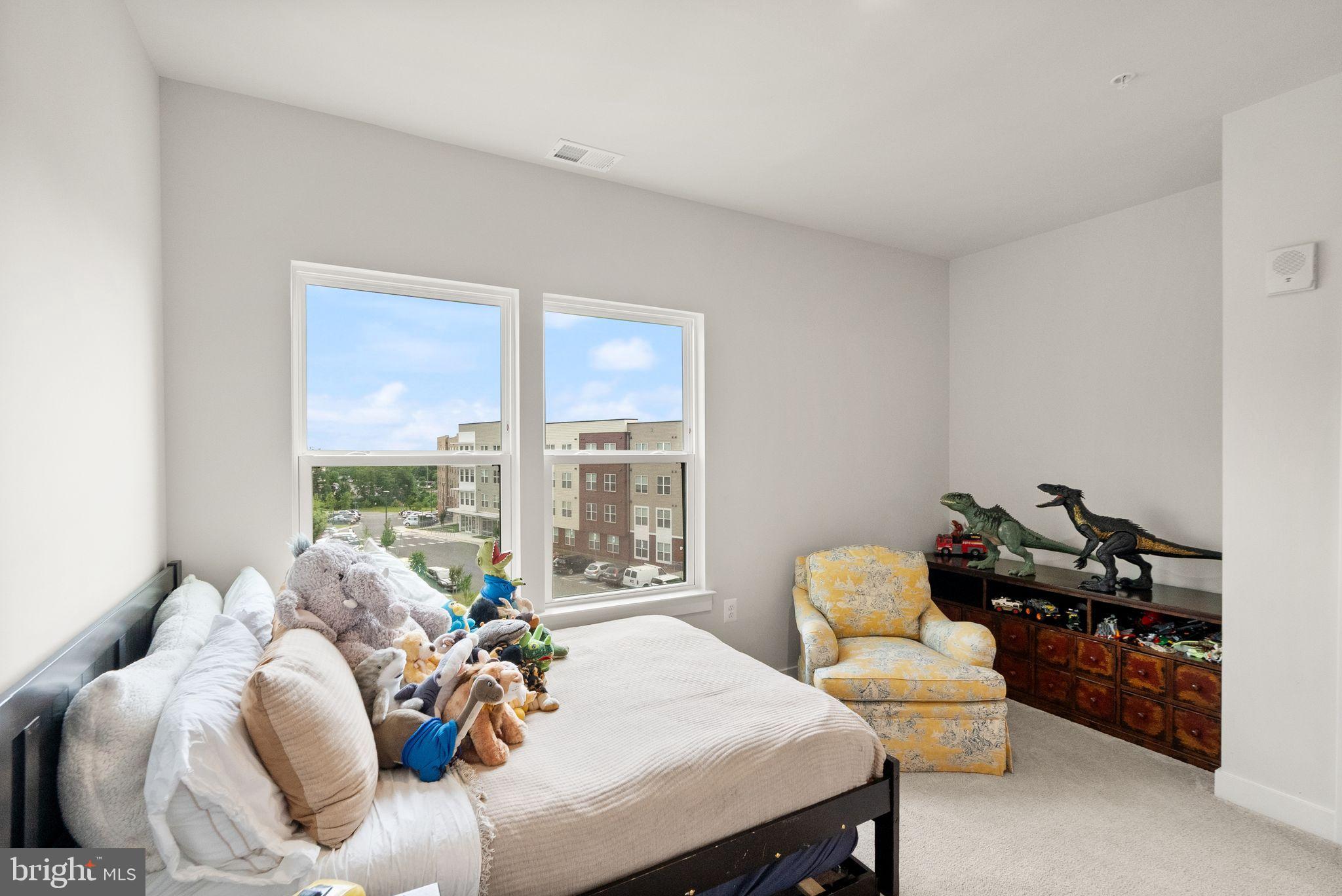 46320 Mount Milstead Terrace, Unit 301 Sterling, VA 20164 - Photo 13 of 24 Bright and playful bedroom with city views.