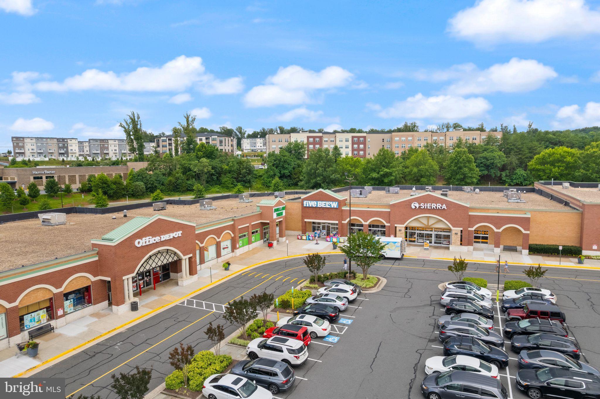 46320 Mount Milstead Terrace, Unit 301 Sterling, VA 20164 - Photo 23 of 24 Vibrant shopping center with lush surroundings.