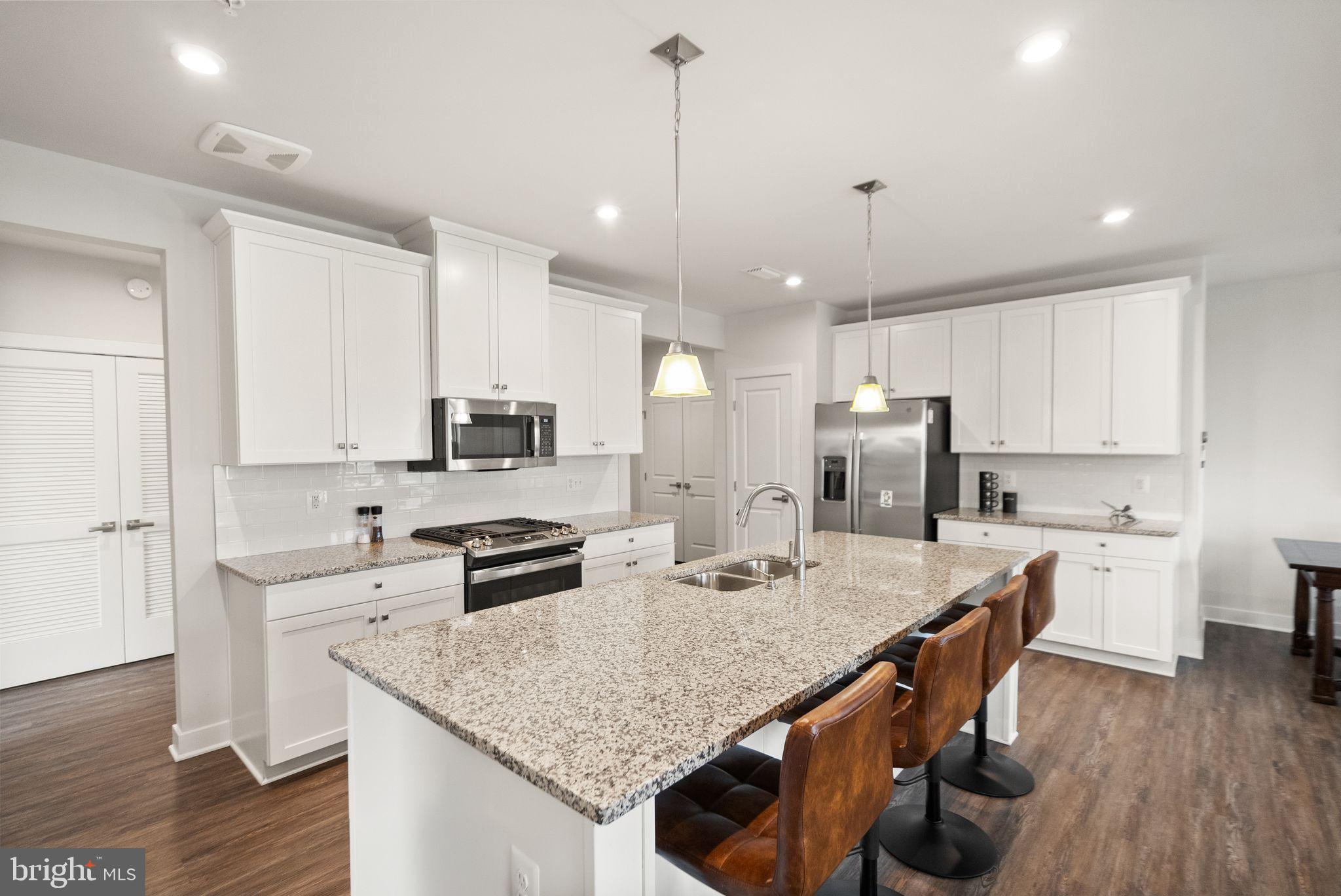 46320 Mount Milstead Terrace, Unit 301 Sterling, VA 20164 - Photo 3 of 24 Oversized island with seating for four.