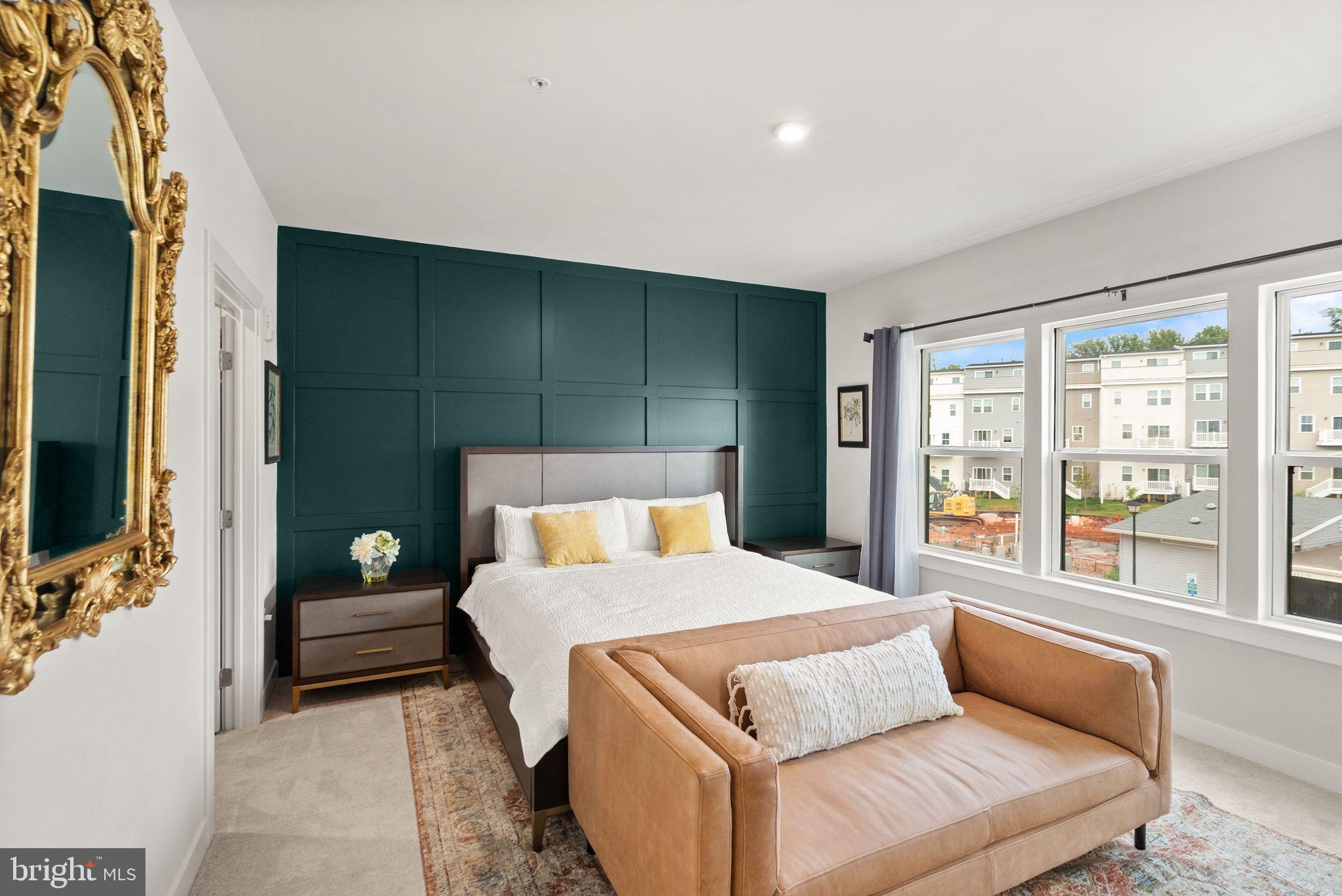 46320 Mount Milstead Terrace, Unit 301 Sterling, VA 20164 - Photo 8 of 24 Stylish bedroom with vibrant accent wall.