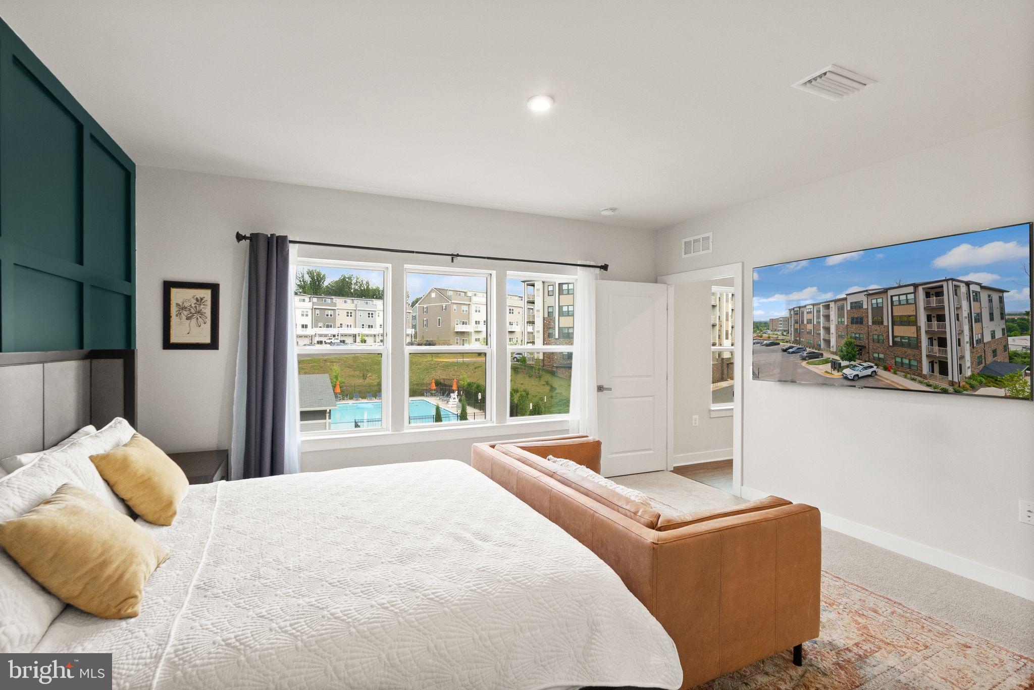 46320 Mount Milstead Terrace, Unit 301 Sterling, VA 20164 - Photo 9 of 24 Serene bedroom with scenic views.