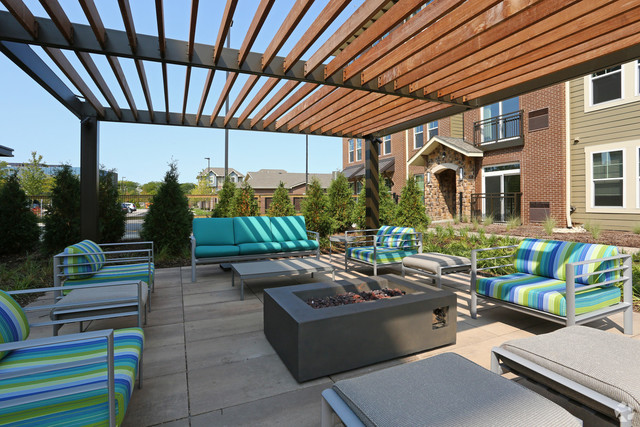670 East Algonquin Road, Unit 4206 Schaumburg, IL 60173 - Photo 23 of 27 a view of a patio with couches and potted plants