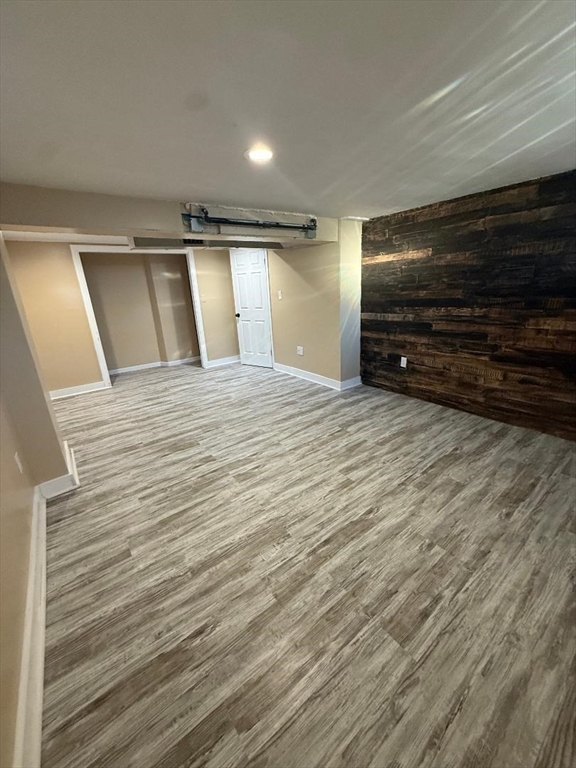36 Daley Street Chicopee, MA 01013 - Photo 24 of 31 a view of an empty room with wooden floor and a window