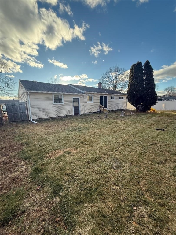 36 Daley Street Chicopee, MA 01013 - Photo 4 of 31 a view of a house with a yard