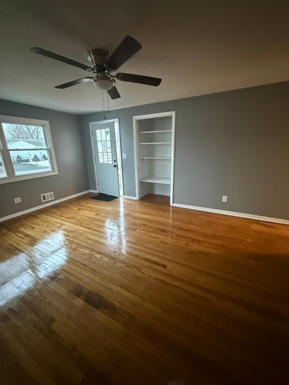 36 Daley Street Chicopee, MA 01013 - Photo 5 of 31 a view of an empty room with window and wooden floor