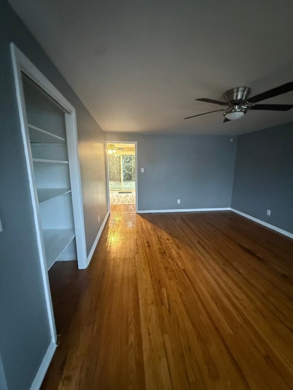 36 Daley Street Chicopee, MA 01013 - Photo 7 of 31 wooden floor in an empty room with a window