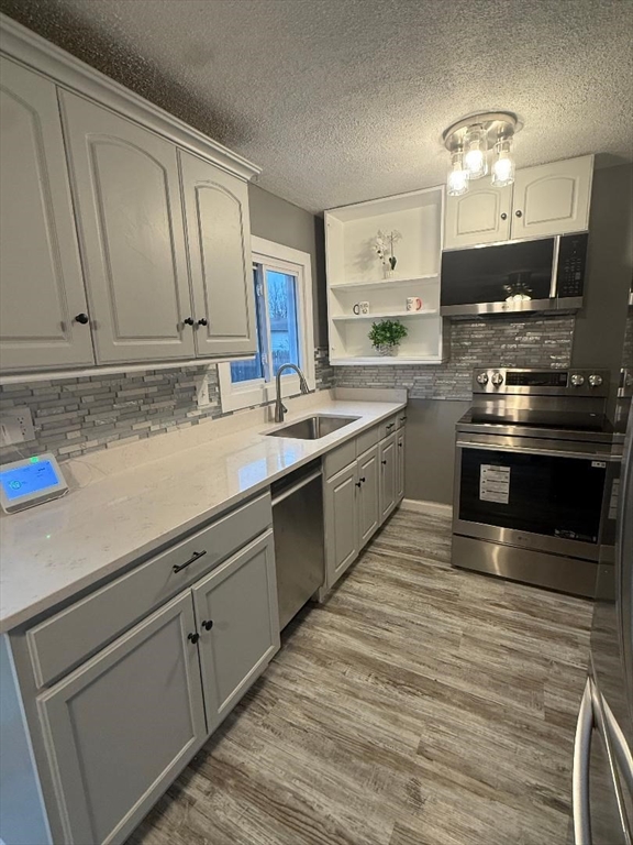 36 Daley Street Chicopee, MA 01013 - Photo 8 of 31 a kitchen with stainless steel appliances granite countertop a sink stove and refrigerator