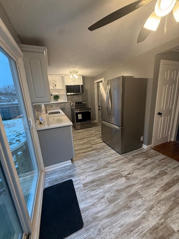 36 Daley Street Chicopee, MA 01013 - Photo 9 of 31 a kitchen with stainless steel appliances a refrigerator and a stove