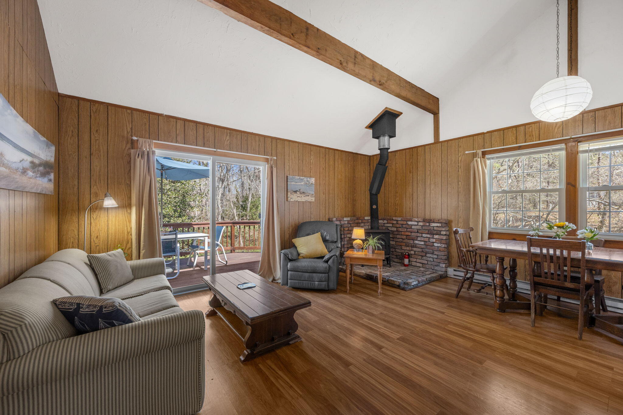60 Long Avenue, Unit A Wellfleet, MA 02667 - Photo 10 of 28 a living room with furniture and a large window