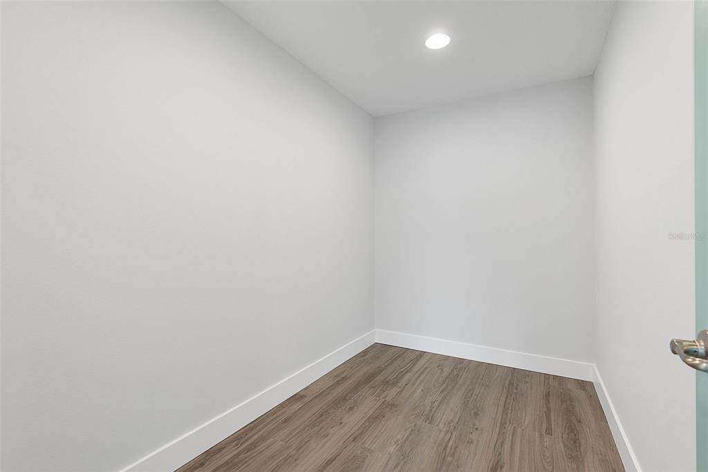 261 South Main Street Bunnell, FL 32110 - Photo 27 of 56 a view of an empty room with wooden floor