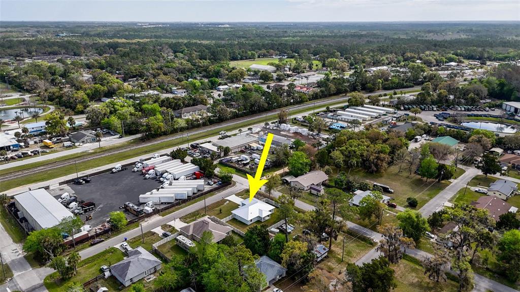 261 South Main Street Bunnell, FL 32110 - Photo 46 of 56 an aerial view of a city with mountains