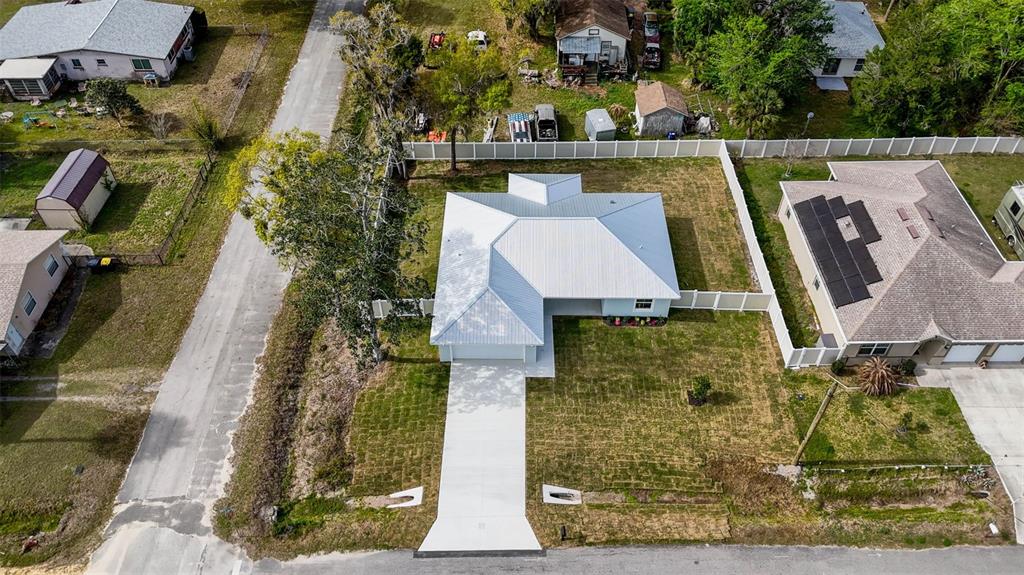 261 South Main Street Bunnell, FL 32110 - Photo 49 of 56 an aerial view of a house with swimming pool