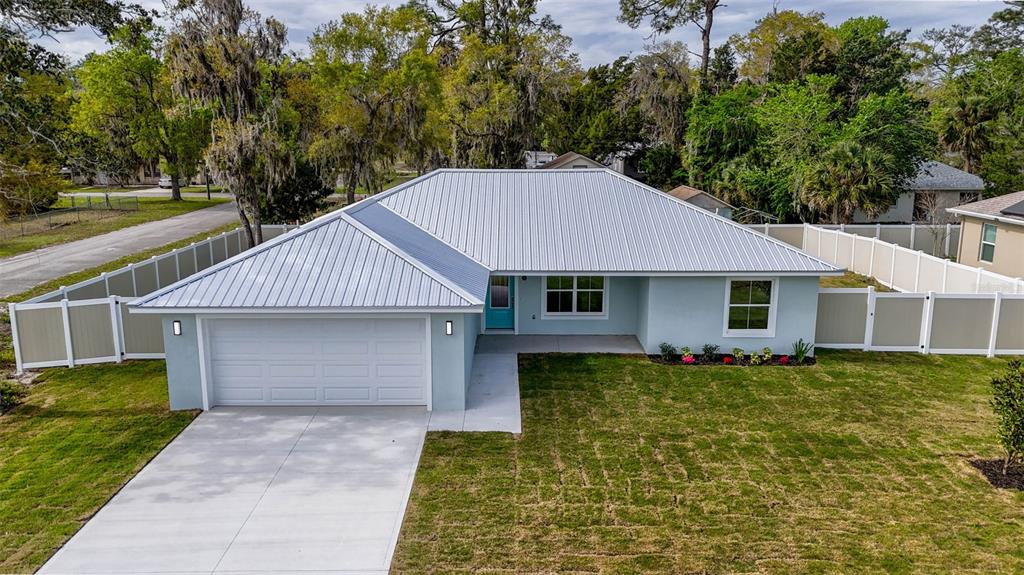 261 South Main Street Bunnell, FL 32110 - Photo 51 of 56 a front view of a house with garden