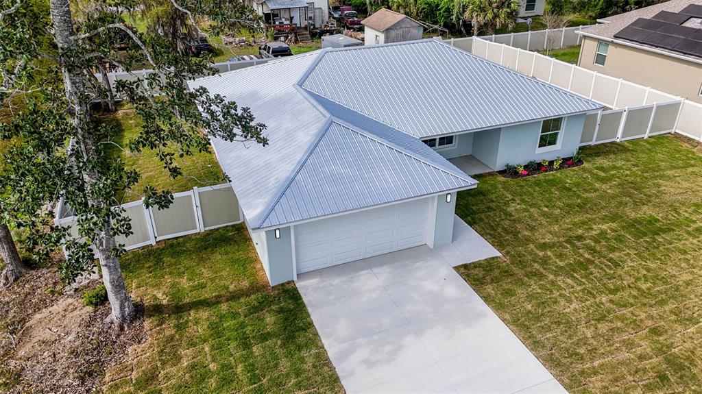 261 South Main Street Bunnell, FL 32110 - Photo 53 of 56 an aerial view of a house with a yard
