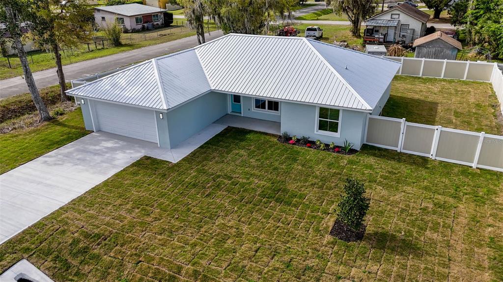 261 South Main Street Bunnell, FL 32110 - Photo 54 of 56 a view of a house with a yard and sitting area
