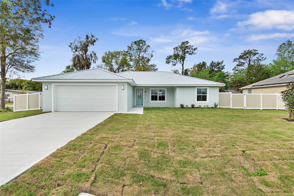 261 South Main Street Bunnell, FL 32110 - Photo 56 of 56 a front view of a house with a garden
