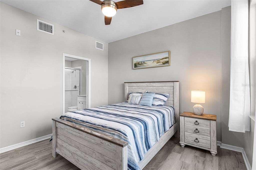 2060 Matecumbe Key Road, Unit 2307 Punta Gorda, FL 33955 - Photo 12 of 45 a bedroom with a bed and a lamp on the dresser