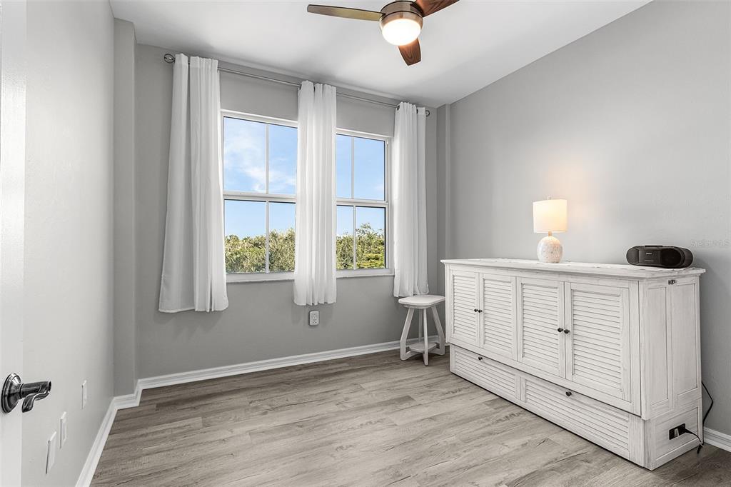 2060 Matecumbe Key Road, Unit 2307 Punta Gorda, FL 33955 - Photo 16 of 45 wooden floor in an empty room with a window