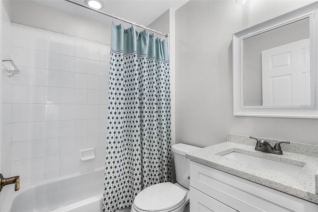 2060 Matecumbe Key Road, Unit 2307 Punta Gorda, FL 33955 - Photo 19 of 45 a bathroom with a sink toilet and shower