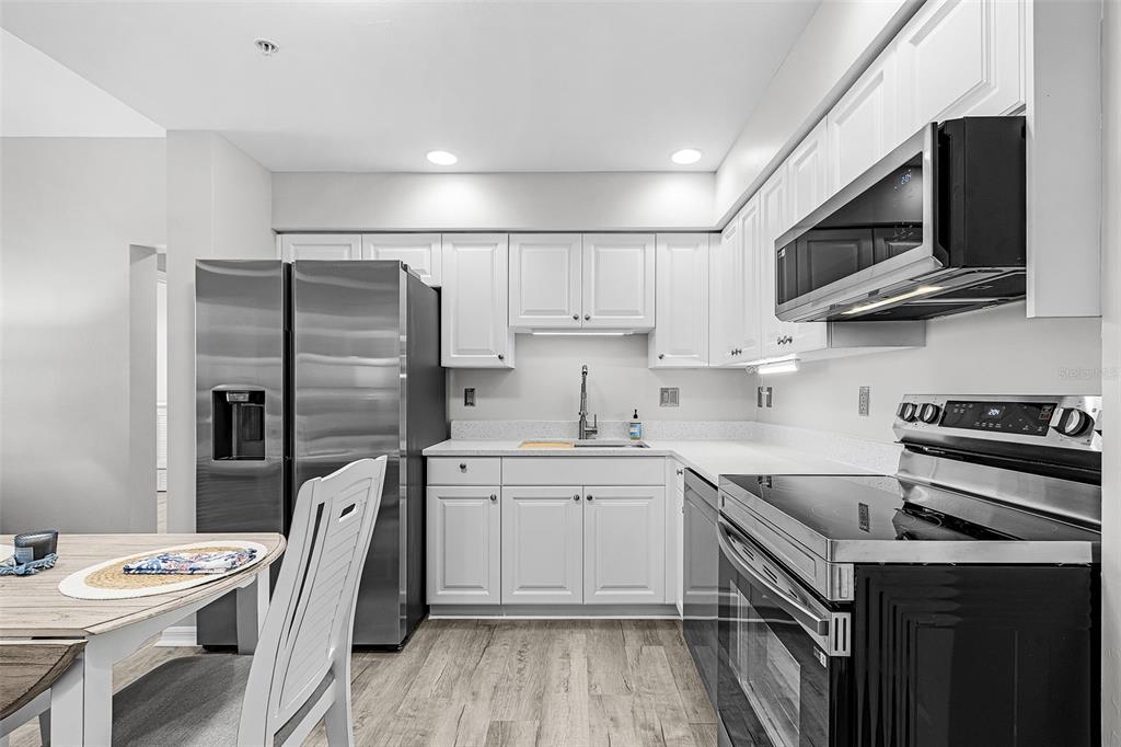 2060 Matecumbe Key Road, Unit 2307 Punta Gorda, FL 33955 - Photo 3 of 45 a kitchen with a sink stove and refrigerator