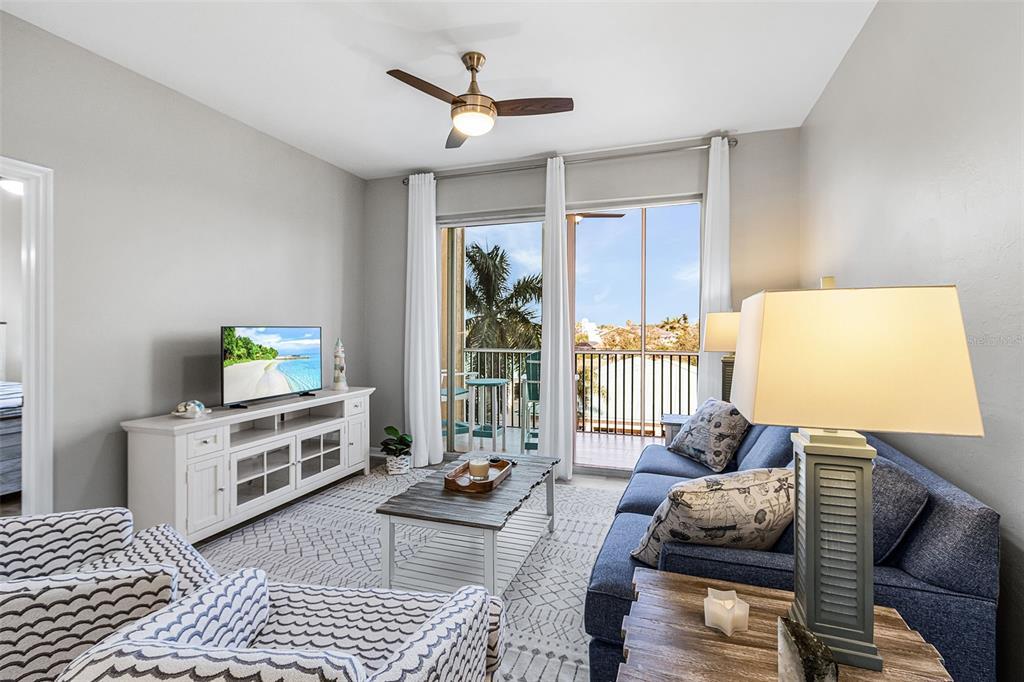 2060 Matecumbe Key Road, Unit 2307 Punta Gorda, FL 33955 - Photo 6 of 45 a living room with furniture and a window