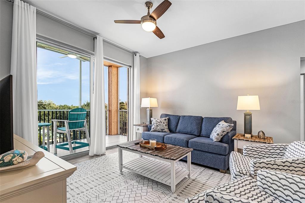 2060 Matecumbe Key Road, Unit 2307 Punta Gorda, FL 33955 - Photo 7 of 45 a living room with furniture and a large window