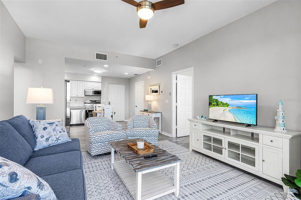 2060 Matecumbe Key Road, Unit 2307 Punta Gorda, FL 33955 - Photo 8 of 45 a living room with furniture and a flat screen tv