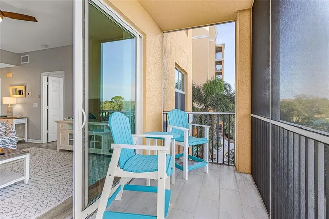 a view of a balcony with furniture