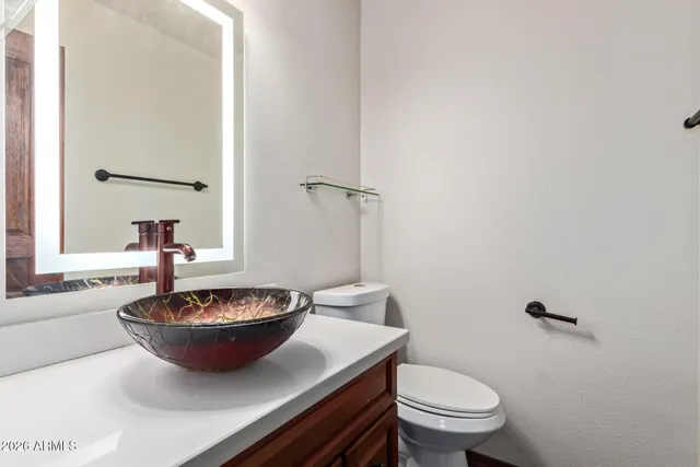 a view of a room with a potted plant and a wooden floor