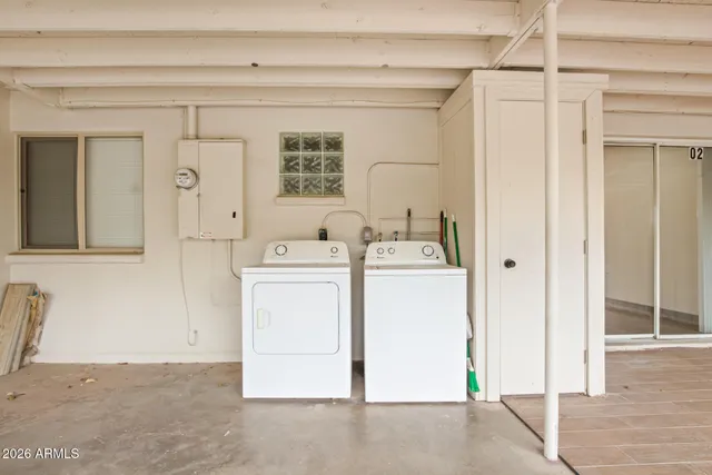 a utility room with dryer and washer