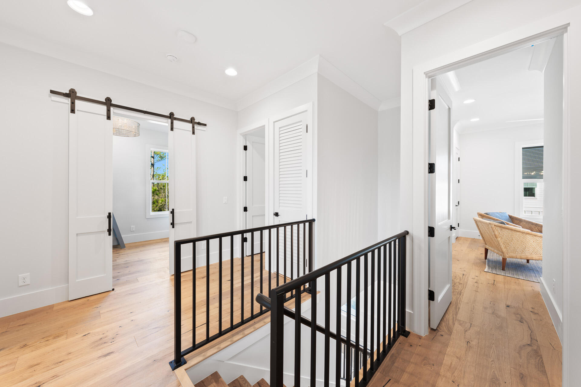 520 South County Highway 393, Unit 39A Santa Rosa Beach, FL 32459 - Photo 29 of 47 a view of a hallway with a large window and wooden floor
