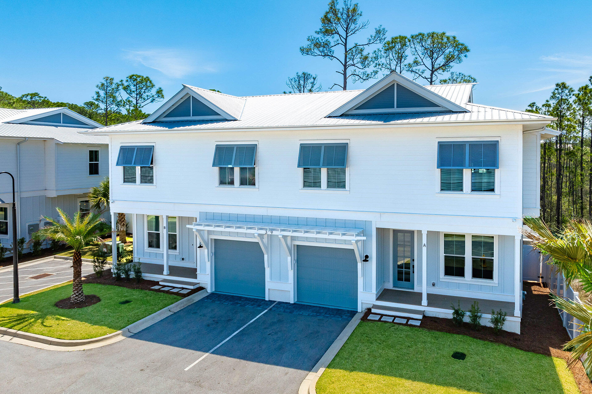 520 South County Highway 393, Unit 39A Santa Rosa Beach, FL 32459 - Photo 43 of 47 a front view of a house with a yard