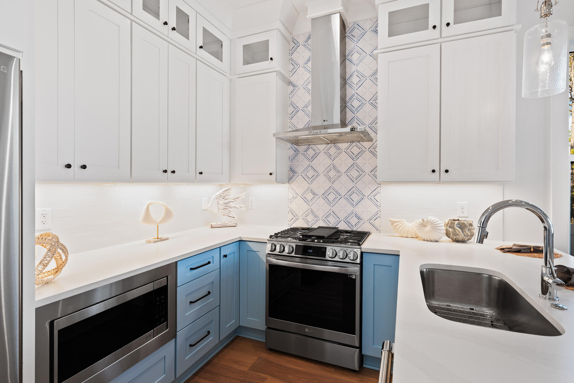 520 South County Highway 393, Unit 39A Santa Rosa Beach, FL 32459 - Photo 7 of 47 a kitchen with stainless steel appliances granite countertop a sink stove and white cabinets