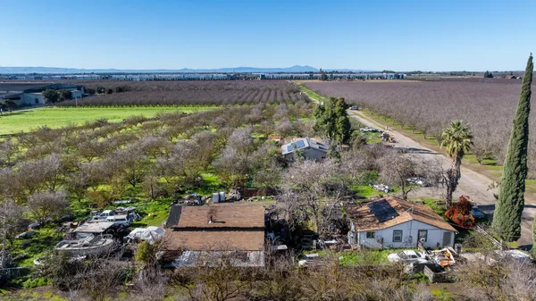 an aerial view of a house with a garden