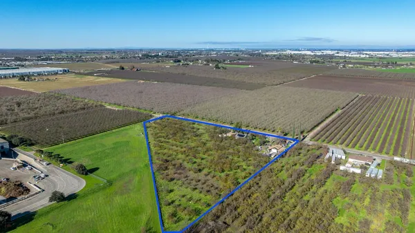 an aerial view of beach and ocean