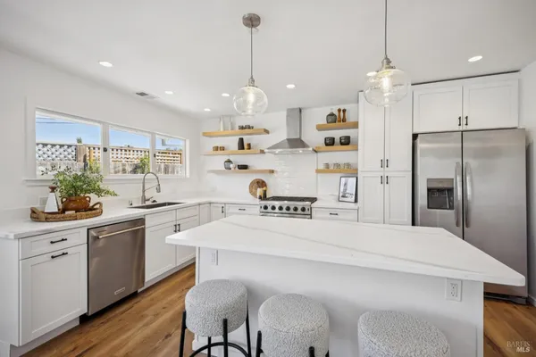 a kitchen with a stove and cabinets